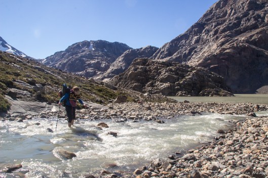 Tim crossing a river on our descent